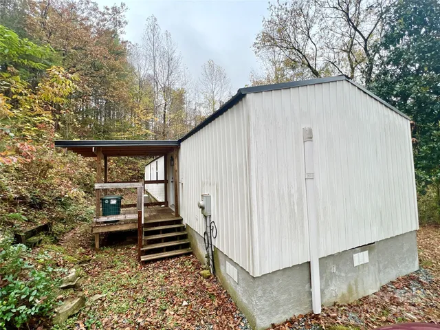 a side view of a house with a yard