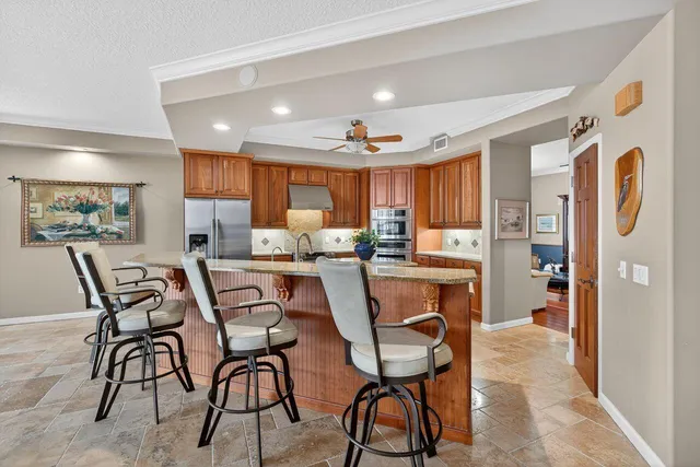 a living room with lots of furniture and a wooden floor