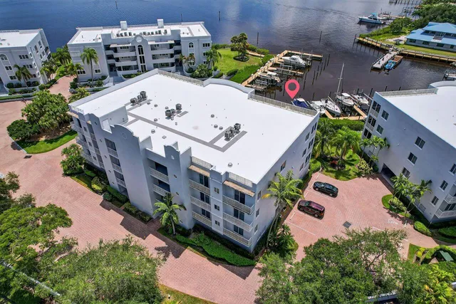 a view of a patio with table and chairs plants and a fire pit