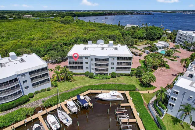 a view of a patio with table and chairs and potted plants