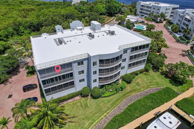 a lobby with furniture and a potted plant