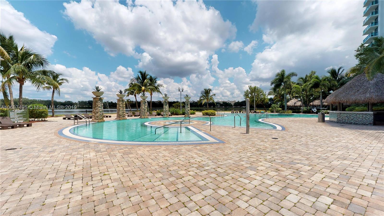 2641 North Flamingo Road, Unit 1401N Plantation, FL 33323 - Photo 12 of 49 a view of a swimming pool with a yard
