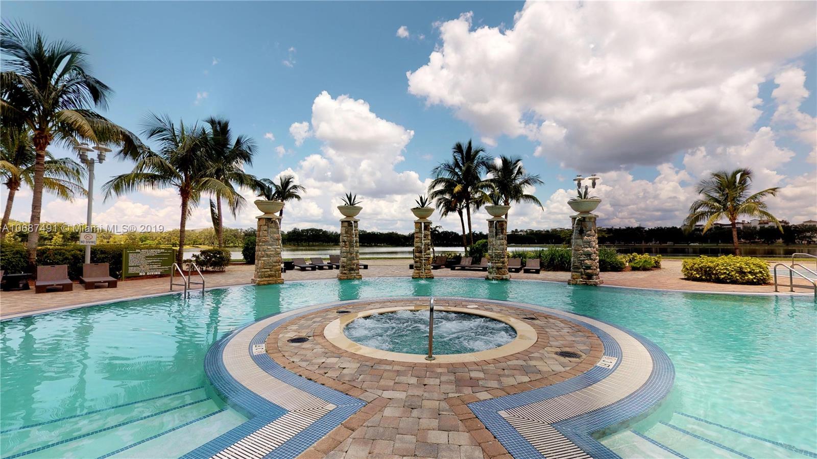 2641 North Flamingo Road, Unit 1401N Plantation, FL 33323 - Photo 13 of 49 a swimming pool with outdoor seating and yard