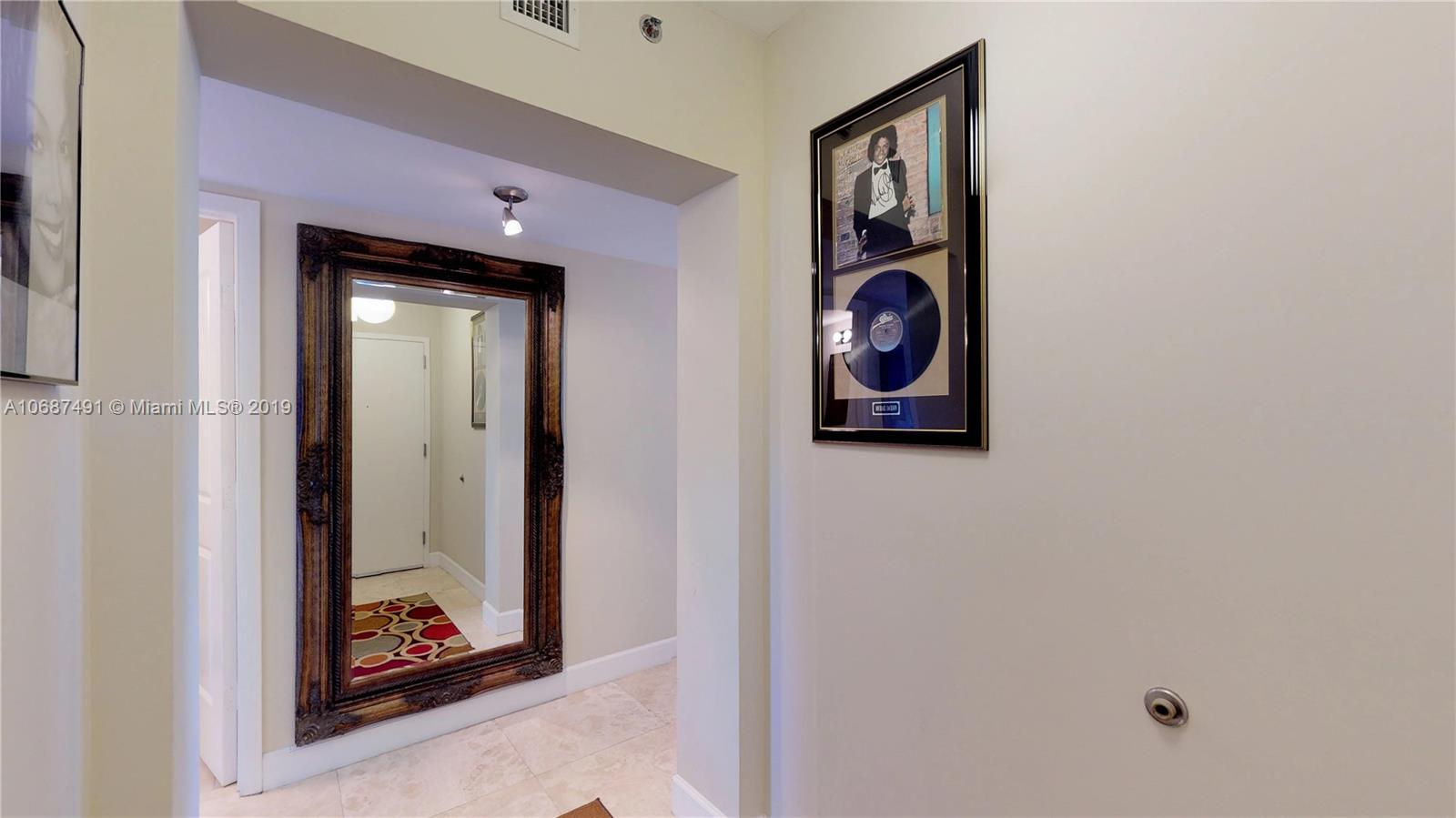 2641 North Flamingo Road, Unit 1401N Plantation, FL 33323 - Photo 19 of 49 a picture of a door and a mirror