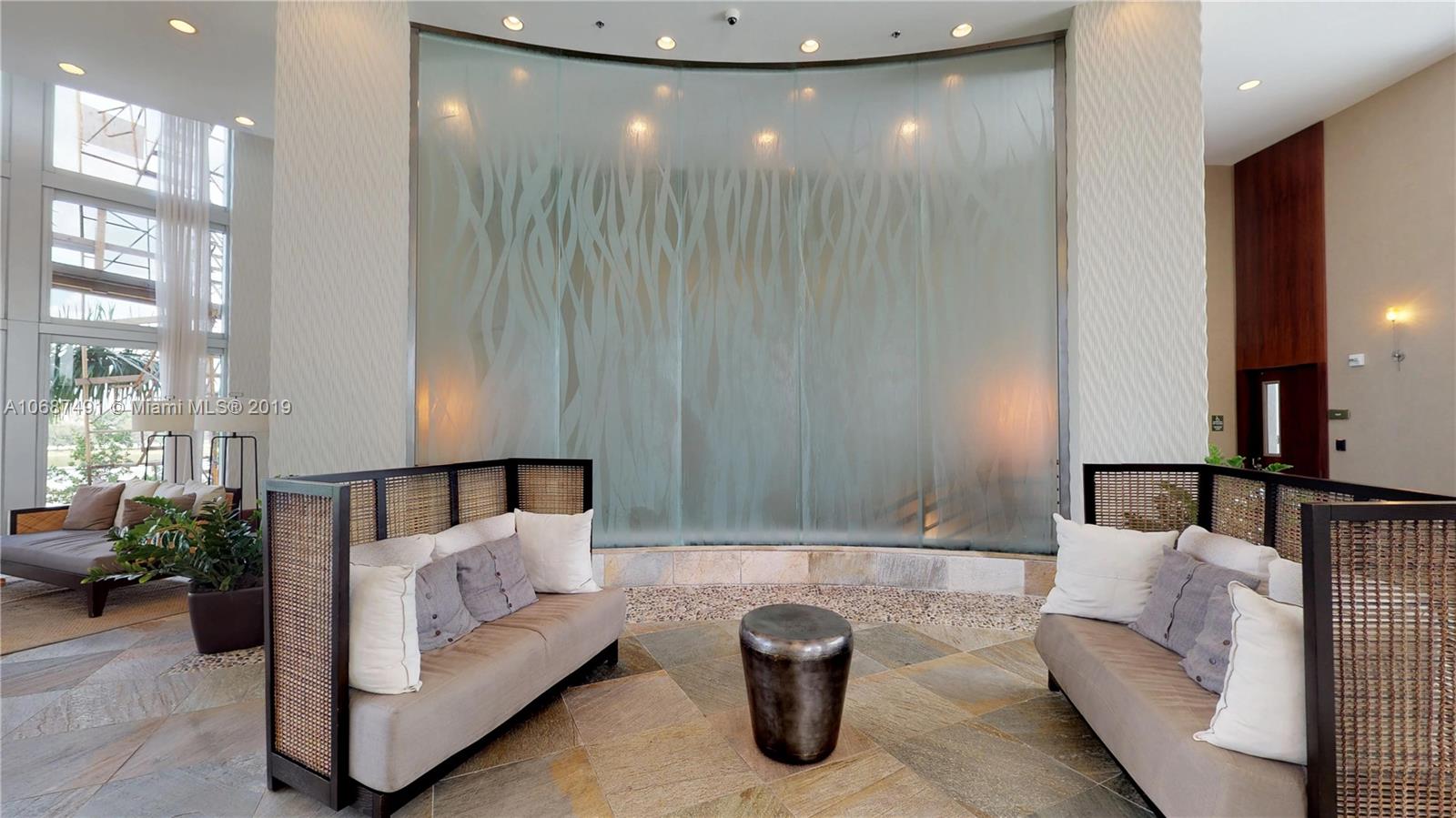 2641 North Flamingo Road, Unit 1401N Plantation, FL 33323 - Photo 2 of 49 a view of a living room and a chandelier