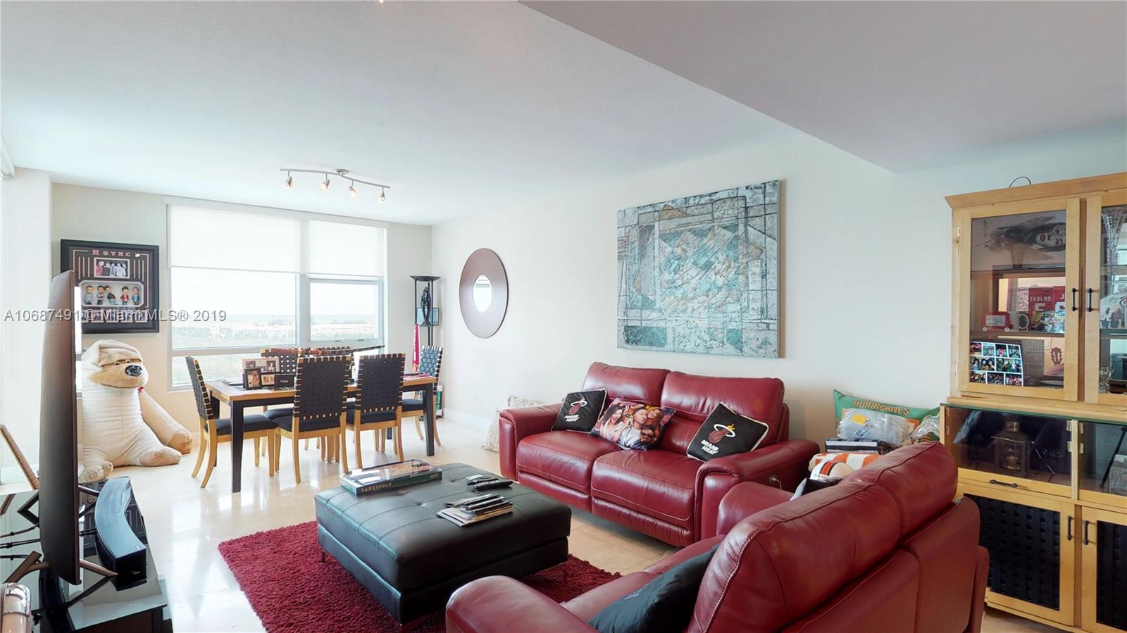2641 North Flamingo Road, Unit 1401N Plantation, FL 33323 - Photo 28 of 49 a living room with furniture or couch and a large window