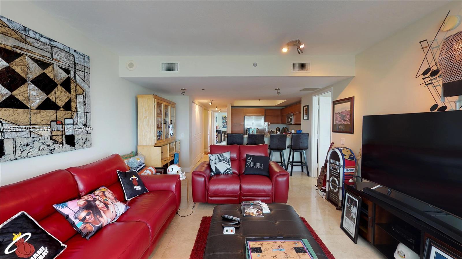 2641 North Flamingo Road, Unit 1401N Plantation, FL 33323 - Photo 30 of 49 a living room with furniture and a flat screen tv