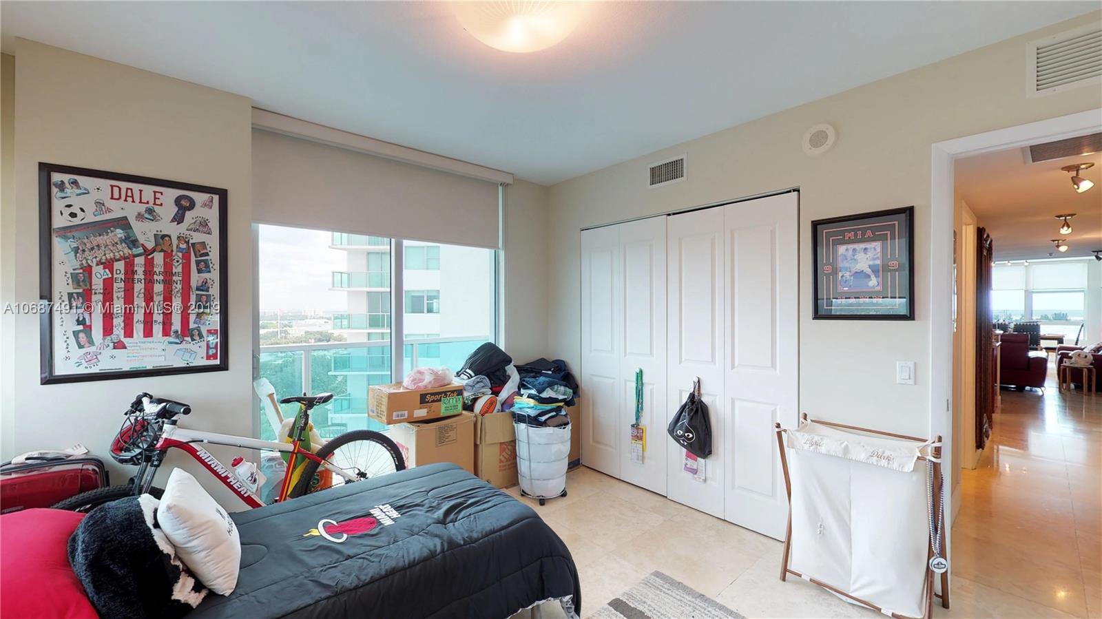 2641 North Flamingo Road, Unit 1401N Plantation, FL 33323 - Photo 45 of 49 a living room with furniture a window and a flat screen tv