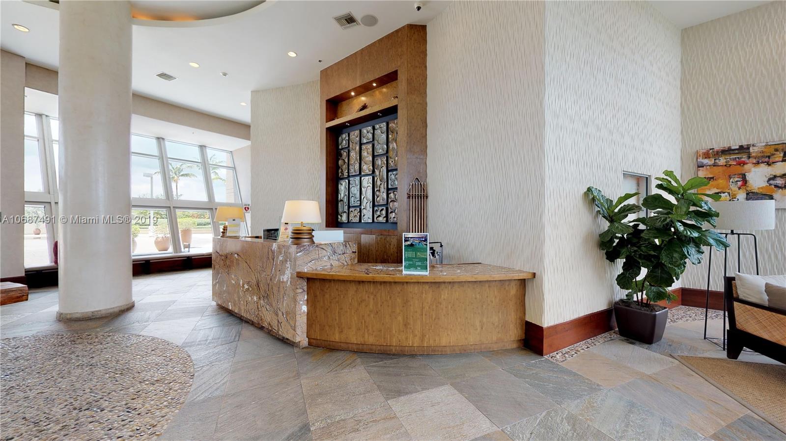 2641 North Flamingo Road, Unit 1401N Plantation, FL 33323 - Photo 6 of 49 a living room with furniture potted plant and a window