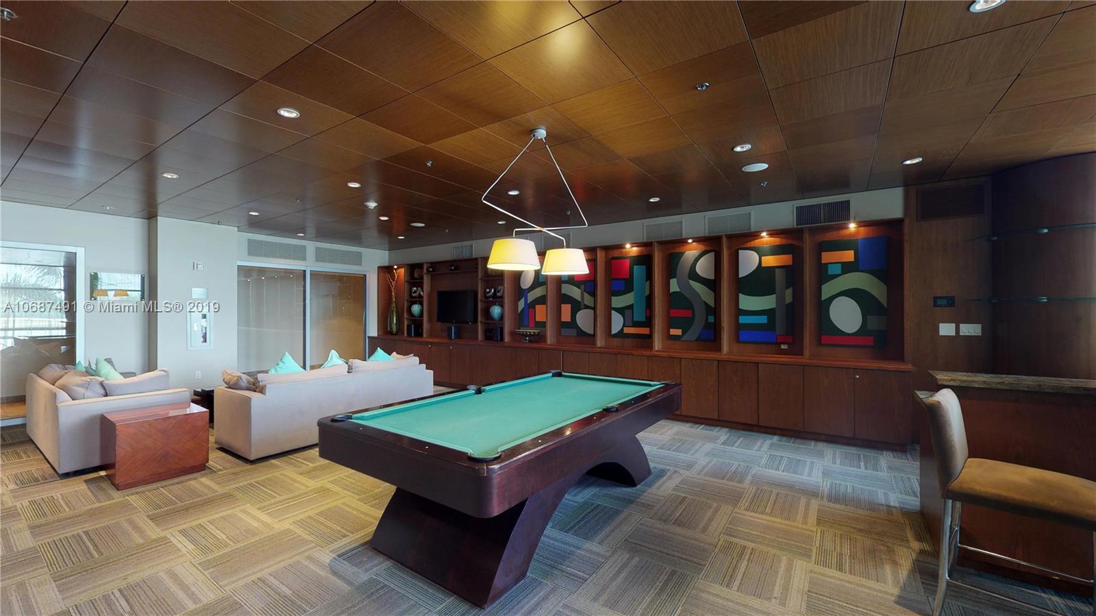 2641 North Flamingo Road, Unit 1401N Plantation, FL 33323 - Photo 8 of 49 a living room with furniture a table and kitchen view