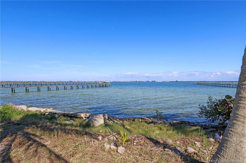 94 North Sewalls Point Road Stuart, FL 34996 - Photo 20 of 35 a view of a lake with a mountain in the background