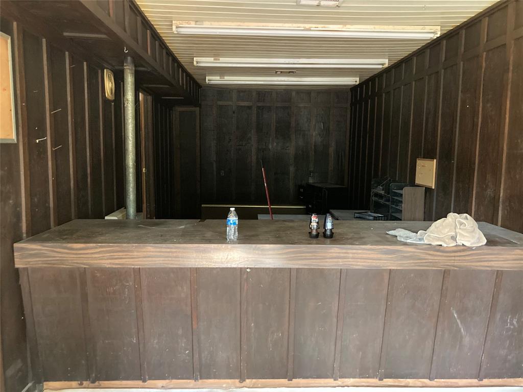 540 Trace Street Many, LA 71449 - Photo 4 of 6 Bar with wood walls