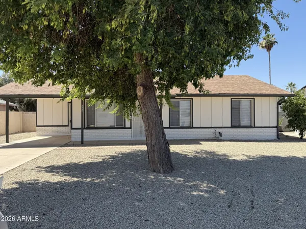 a house with trees in front of it