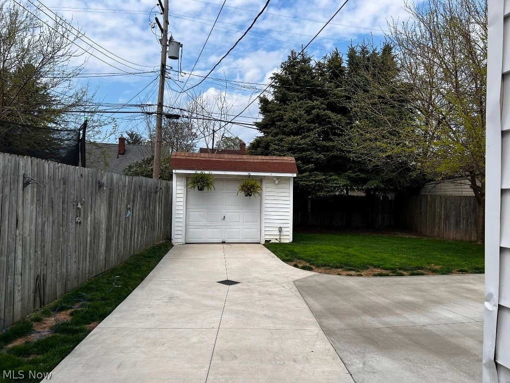 6602 Snow Road Parma, OH 44129 - Photo 19 of 23 Garage with a yard