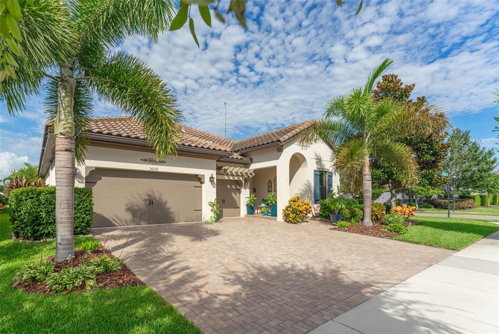 14315 Rolling Dune Road Lithia, FL 33547 - Photo 1 of 1 a view of a white house with a yard and potted plants