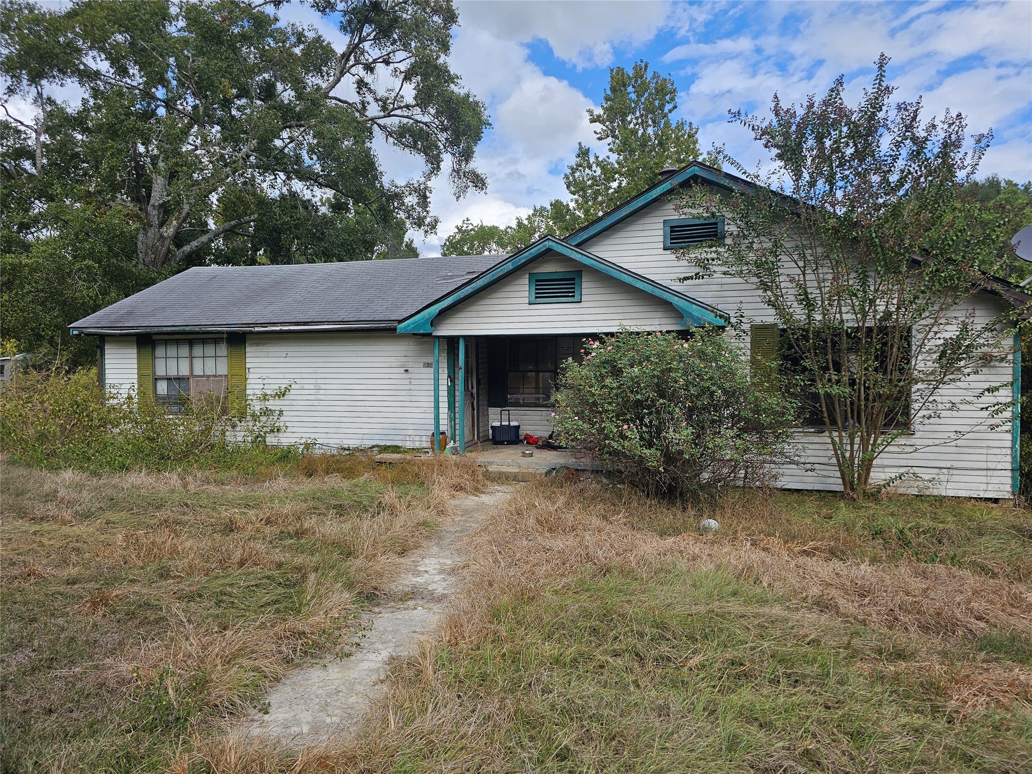 a house with trees in the background