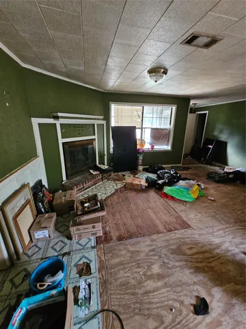 a room with gym equipment and a large window