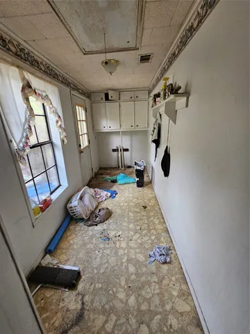 a bedroom with furniture and a window