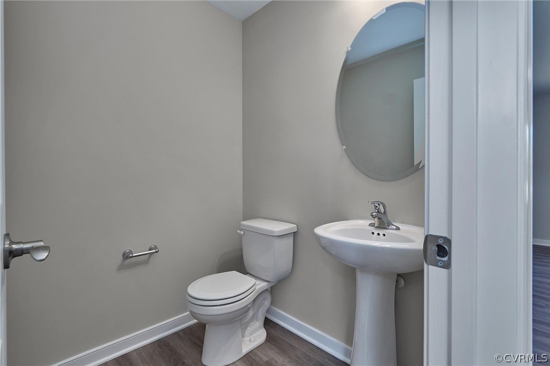 4912 Appelman Ridge Court Chesterfield, VA 23832 - Photo 8 of 34 a bathroom with a toilet sink and mirror