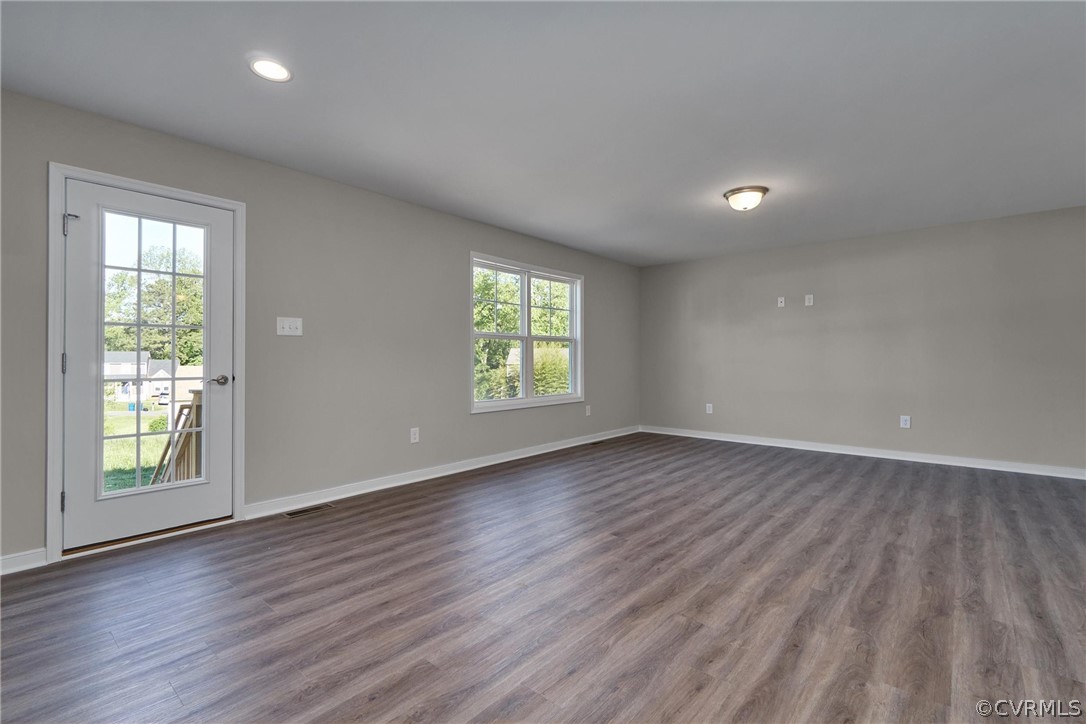4912 Appelman Ridge Court Chesterfield, VA 23832 - Photo 9 of 34 an empty room with wooden floor and windows