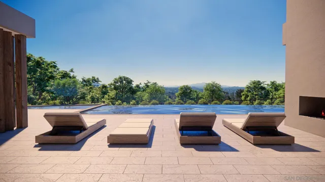a view of a house with swimming pool and sitting area