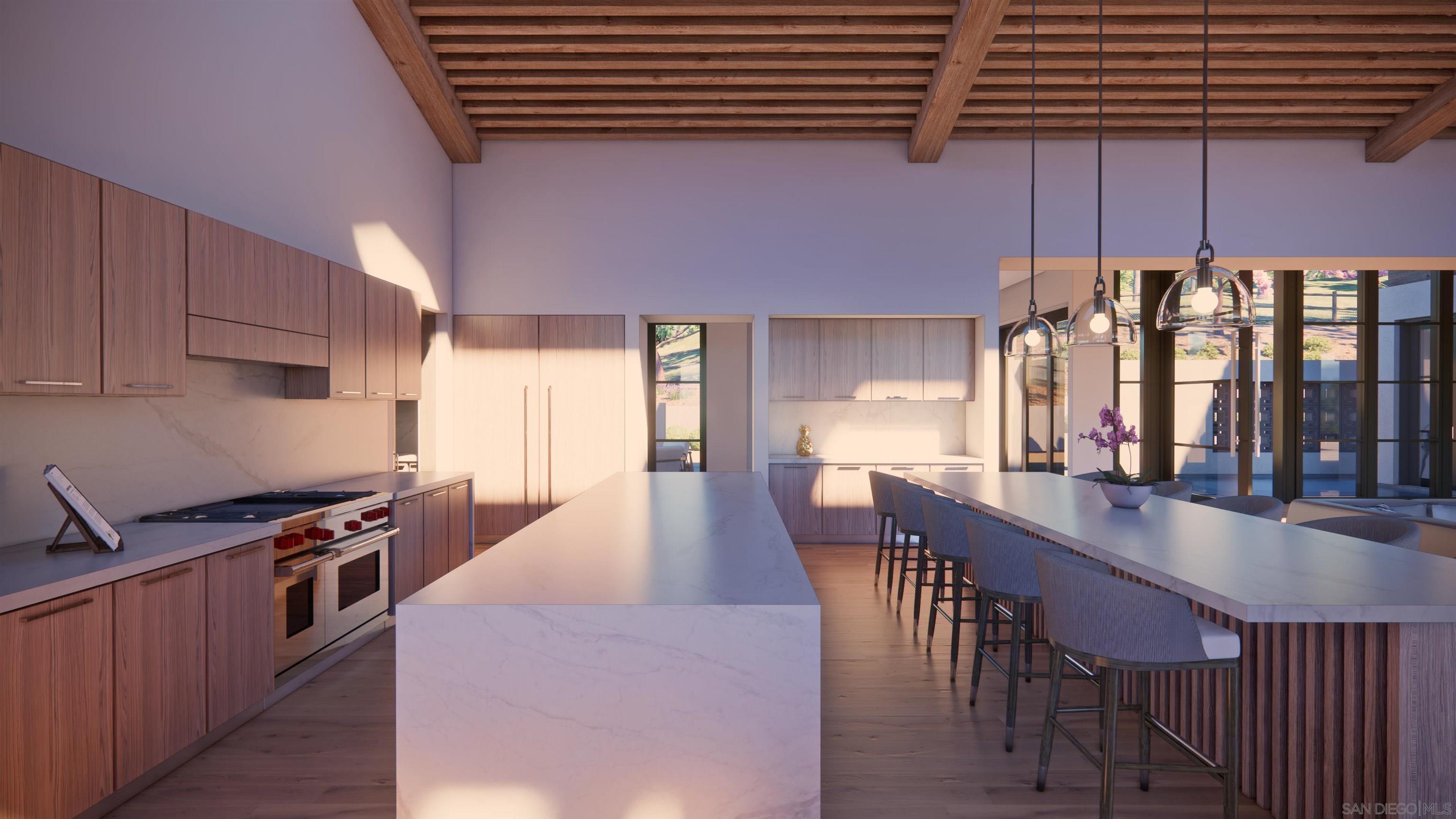 16256 Via Del Alba Rancho Santa Fe, CA 92067 - Photo 21 of 64 a kitchen with stainless steel appliances a dining table chairs and a wooden floor