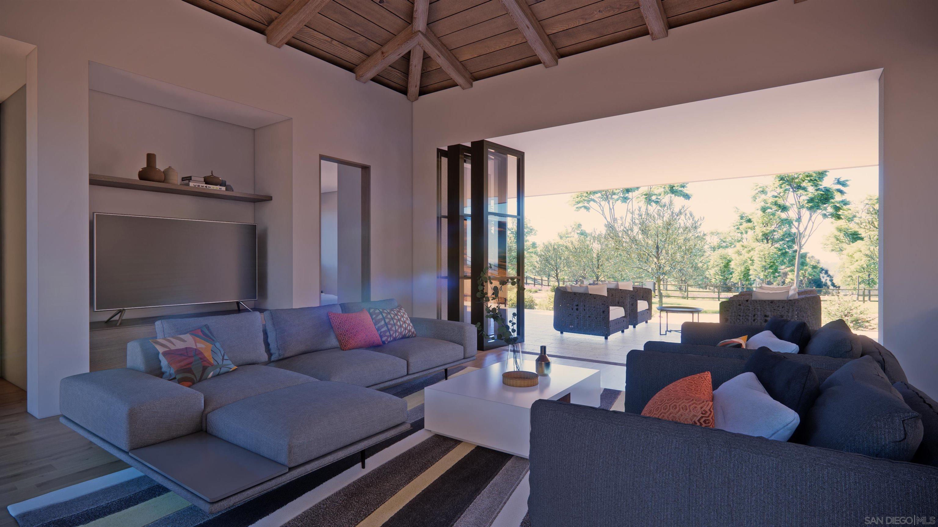 16256 Via Del Alba Rancho Santa Fe, CA 92067 - Photo 57 of 64 a living room with patio furniture and a flat screen tv