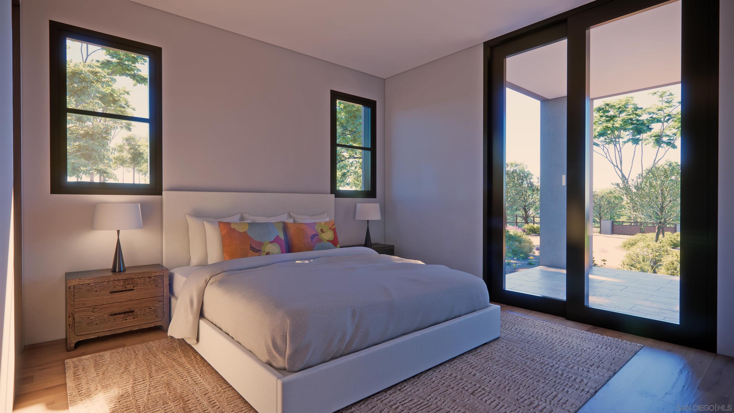 16256 Via Del Alba Rancho Santa Fe, CA 92067 - Photo 61 of 64 a bedroom with a large bed and a large window