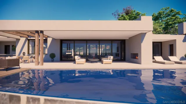 a view of a house with backyard sitting area and garden