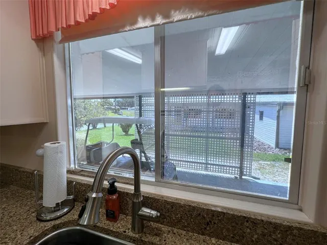 a bed room with bed and window