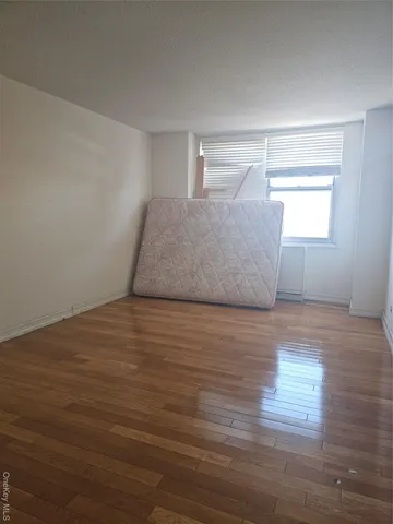 a view of room and wooden floor