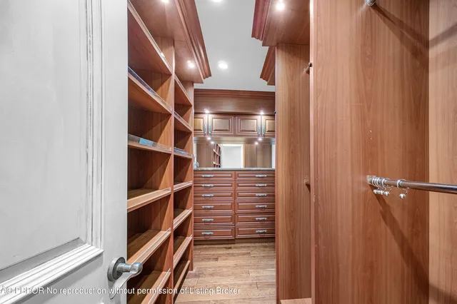 a bedroom with a large bed and a large window