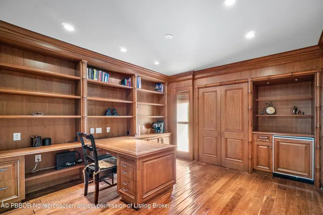 a bathroom with a granite countertop sink a toilet and mirror