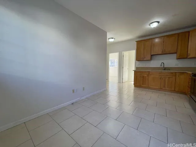 a large kitchen with cabinets and a sink