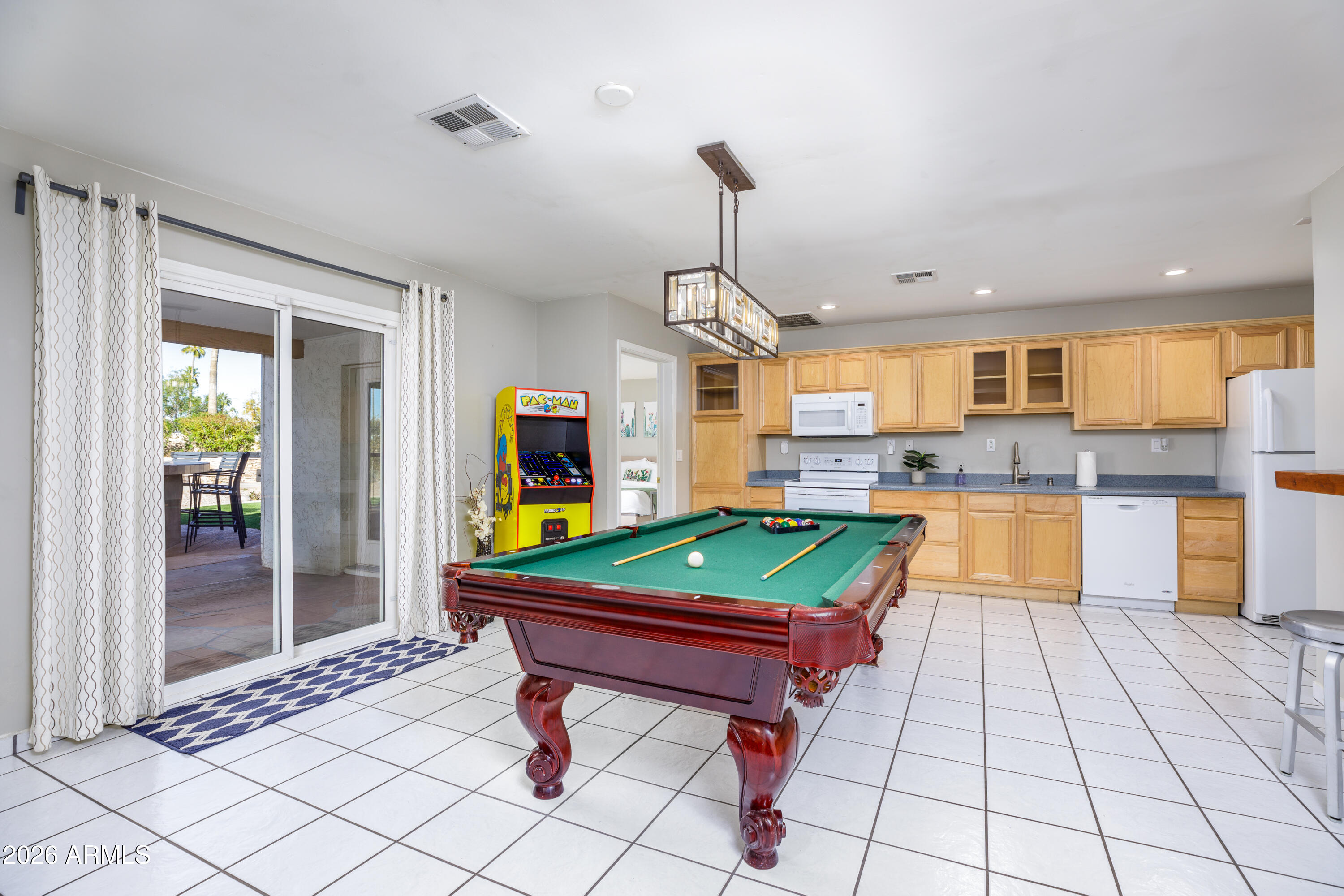6932 East Presidio Road Scottsdale, AZ 85254 - Photo 24 of 30 a room with pool table and windows