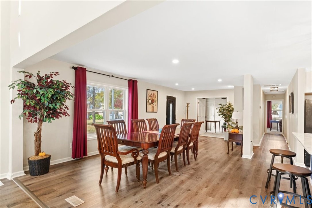 517 West Riverside Drive Lanexa, VA 23089 - Photo 10 of 27 a view of a dining room with furniture window and wooden floor