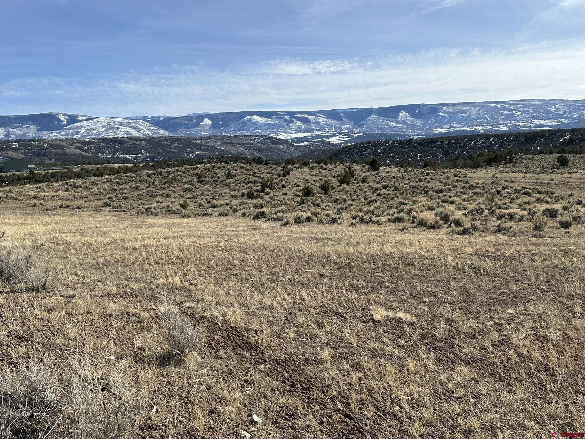 Tbd V Road De Beque, CO 81624 - Photo 3 of 22 a view of lake with mountain