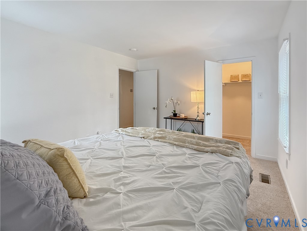 3203 Roland View Terrace Chester, VA 23831 - Photo 12 of 19 Neutral wall color, window with blinds, carpeted f