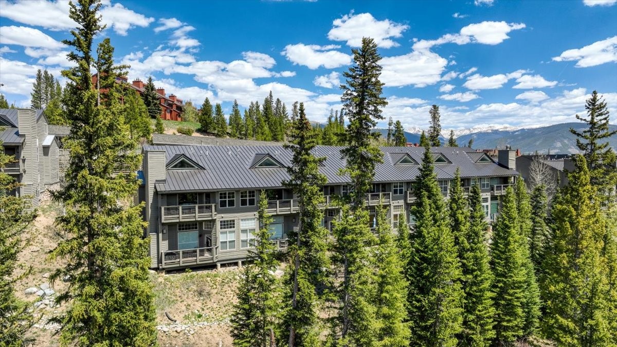 91399 Ryan Gulch Road, Unit B6 Silverthorne, CO 80498 - Photo 33 of 36 a aerial view of a house with a yard and balcony