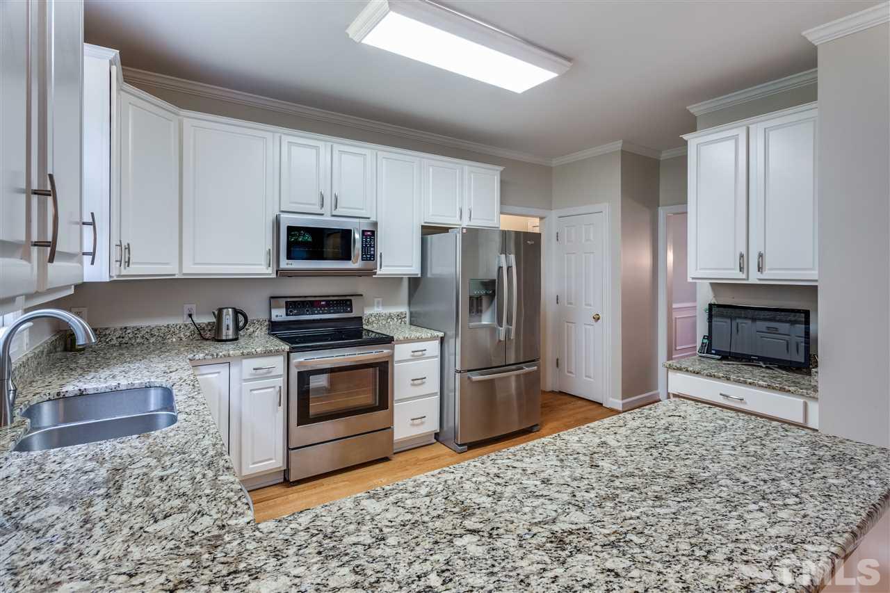2737 Sunnystone Way Raleigh, NC 27613 - Photo 11 of 24 Gorgeous kitchen with stainless steel appliances, granite countertops and refinished cabinetry.