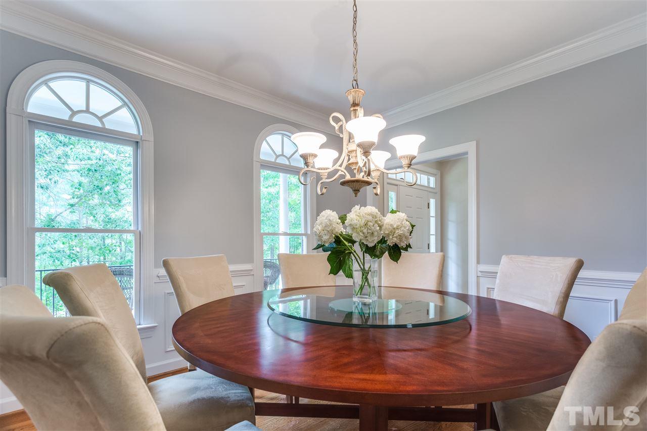 2737 Sunnystone Way Raleigh, NC 27613 - Photo 5 of 24 Elegant dining room with wainscoting and Palladian windows.