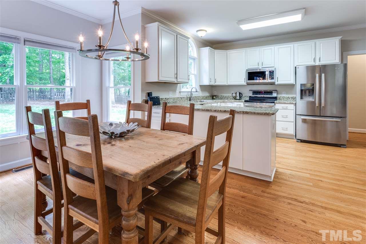 2737 Sunnystone Way Raleigh, NC 27613 - Photo 10 of 24 Enjoy dining with a lovely view of the backyard.