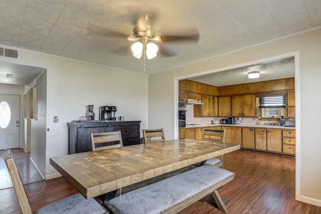 a kitchen with a table and chairs in it