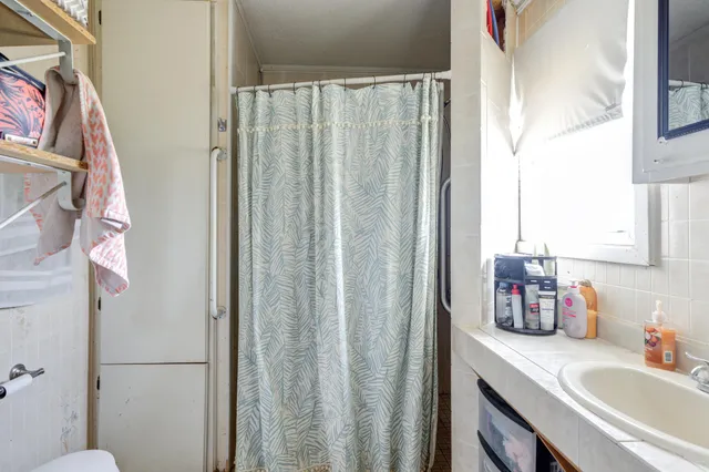 a bathroom with a sink vanity and a mirror