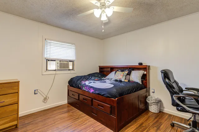 a bed room with a bed and a window