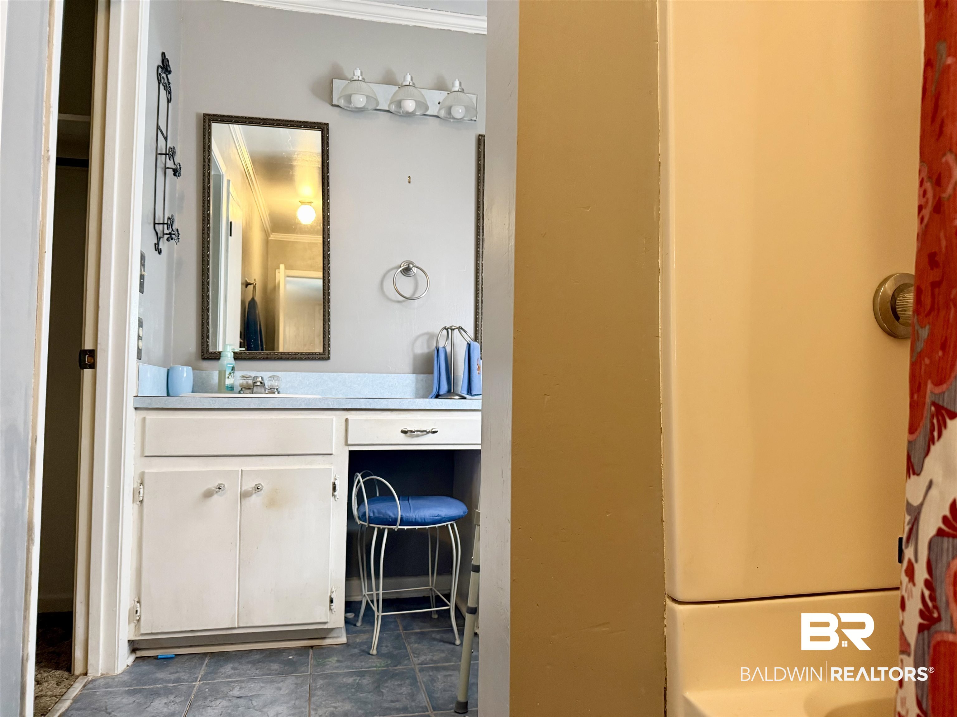 98 Evans Avenue Brewton, AL 36426 - Photo 9 of 18 Full bathroom with vanity, shower / tub combo with curtain, and crown molding