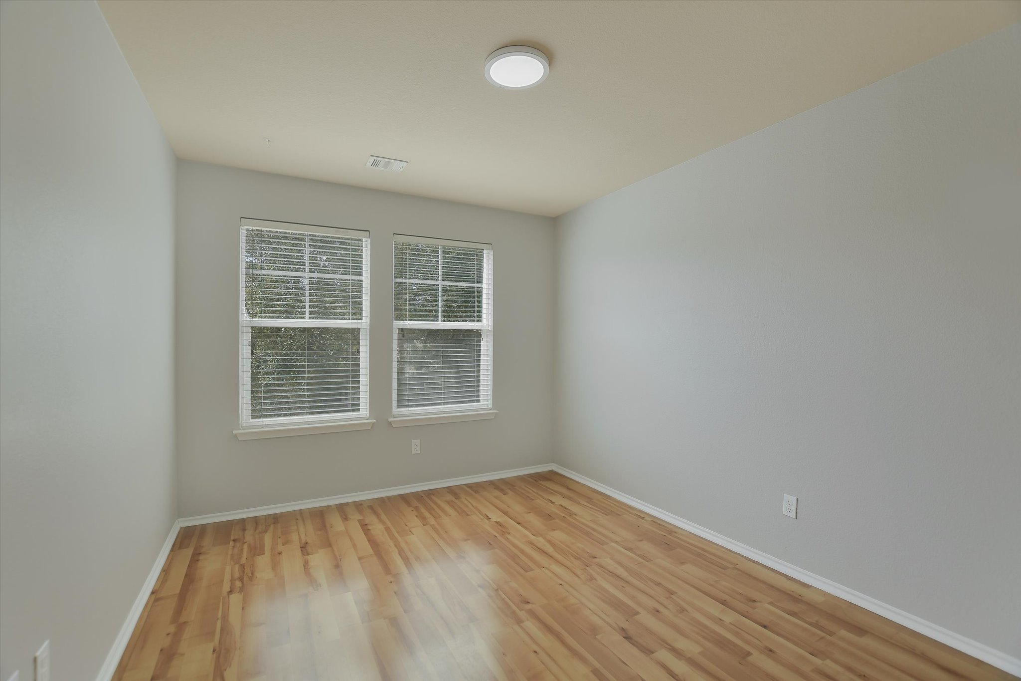 1420 Huckleberry Lane Austin, TX 78748 - Photo 17 of 21 2nd Bedroom with light wood-style floors and baseboards