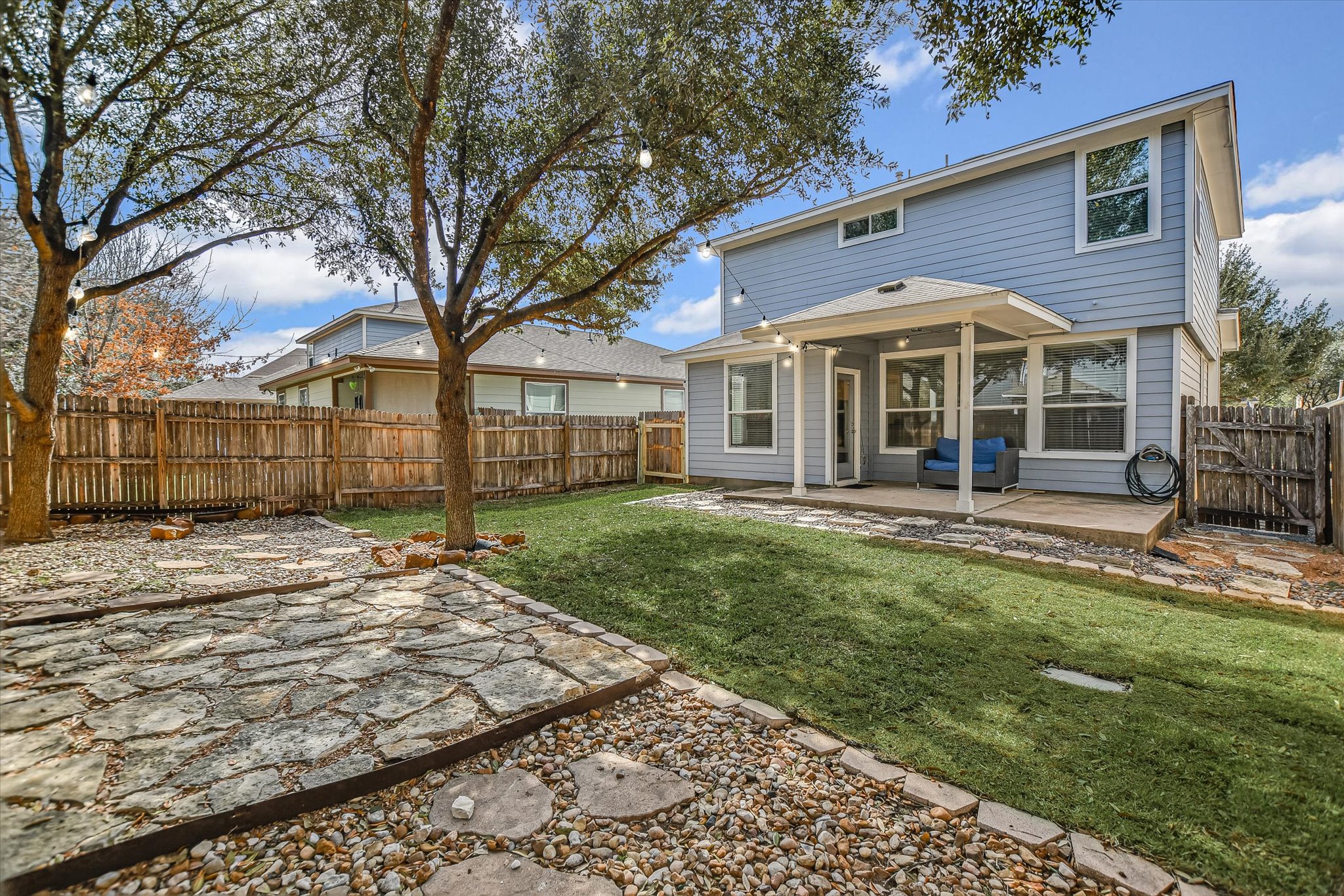 1420 Huckleberry Lane Austin, TX 78748 - Photo 21 of 21 Back of house with a patio and a fenced backyard