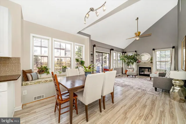 a living room with fireplace furniture and a wooden floor