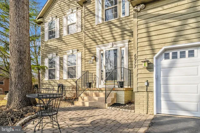 a view of a brick building next to a yard